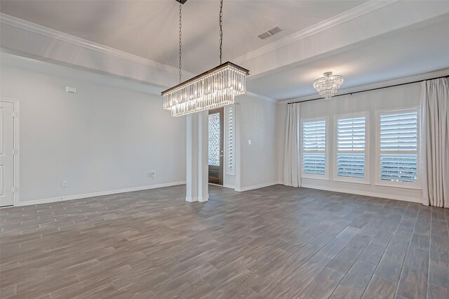 interior space with an inviting chandelier, crown molding, and dark wood-type flooring