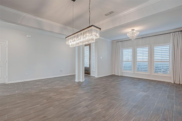 unfurnished dining area with crown molding, an inviting chandelier, and dark hardwood / wood-style flooring