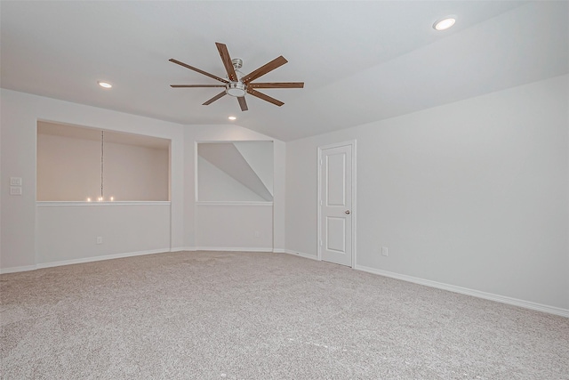 empty room featuring carpet floors and ceiling fan with notable chandelier