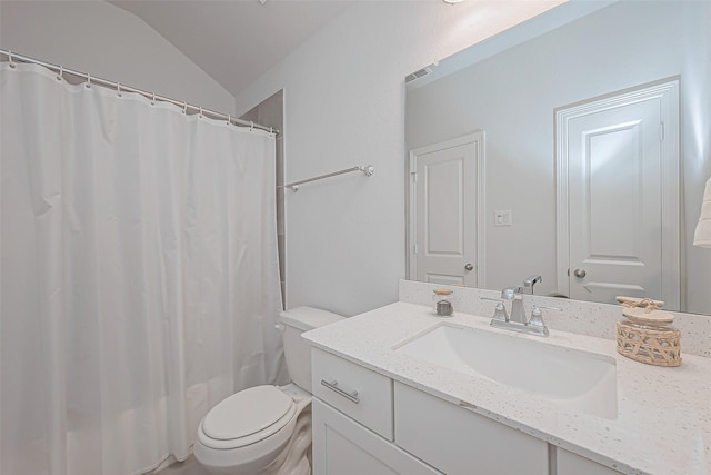 bathroom featuring vanity, curtained shower, and toilet