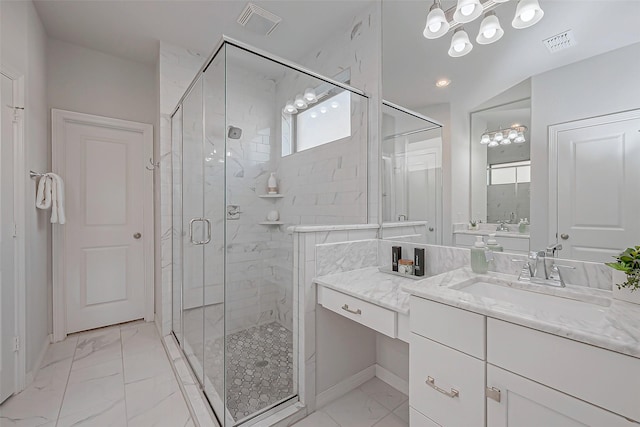 bathroom featuring vanity and an enclosed shower