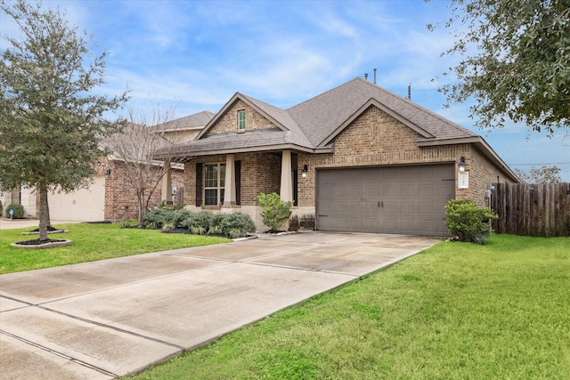 view of front of property with a garage and a front yard