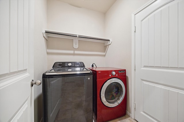 laundry area with independent washer and dryer