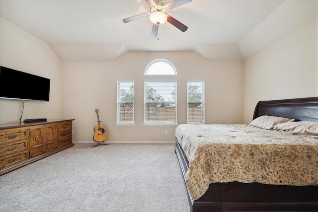 carpeted bedroom featuring lofted ceiling and ceiling fan