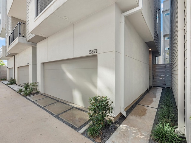 view of property exterior with a garage