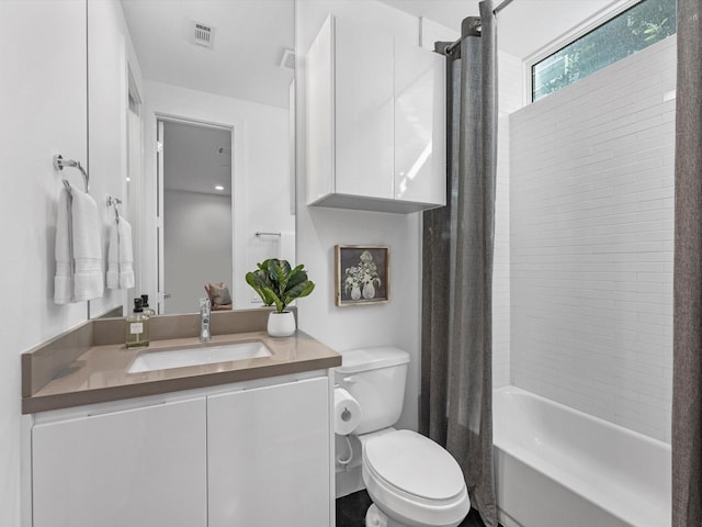 full bathroom with vanity, toilet, and shower / bath combo with shower curtain