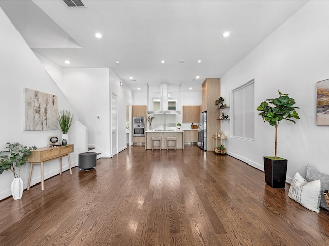 living room with dark hardwood / wood-style flooring