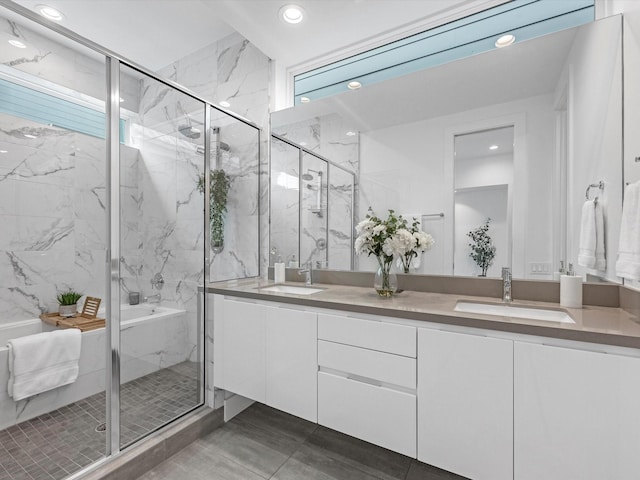 bathroom with vanity and a shower with shower door