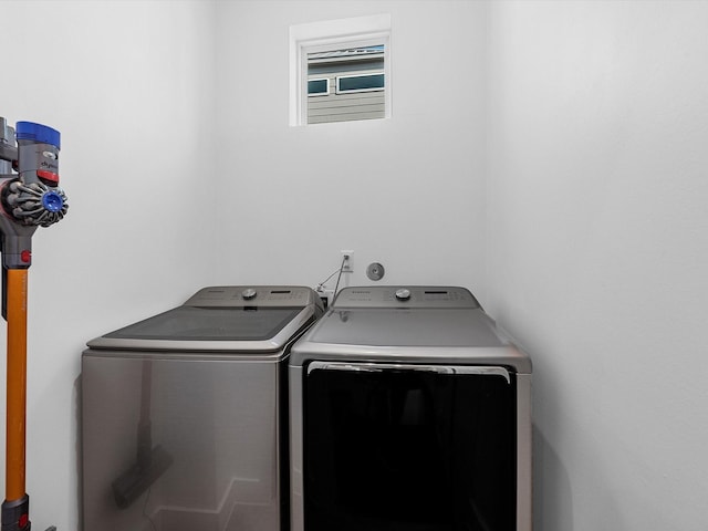 laundry area with washing machine and clothes dryer