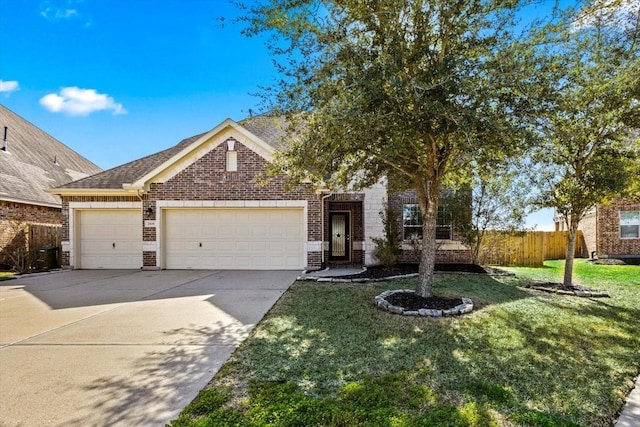 view of front of house featuring a garage and a front yard