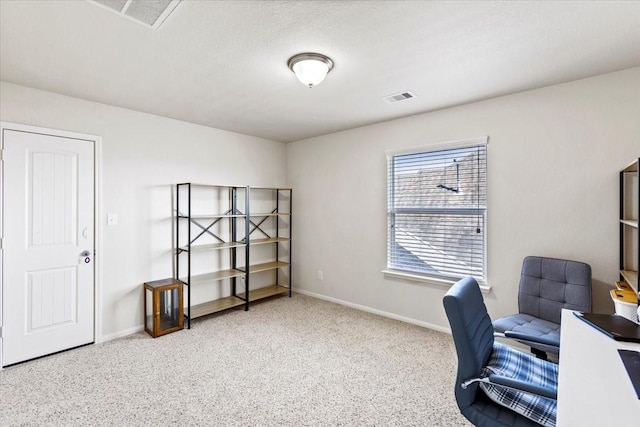 office space featuring carpet and a textured ceiling