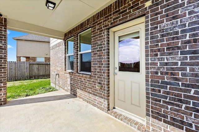 doorway to property featuring a patio area