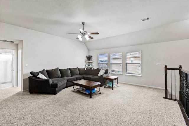 carpeted living room featuring vaulted ceiling and ceiling fan