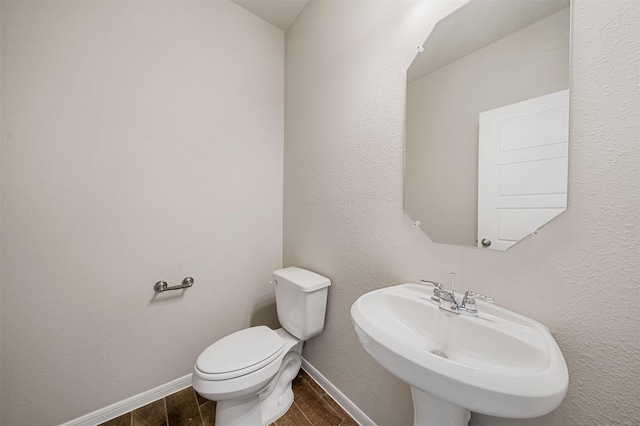 bathroom featuring sink and toilet