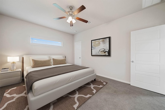 bedroom with dark colored carpet and ceiling fan