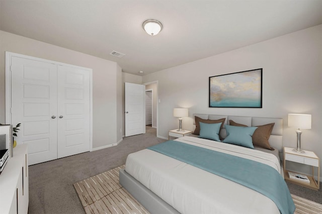 carpeted bedroom featuring a closet