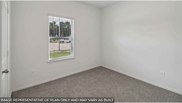 carpeted spare room with a healthy amount of sunlight