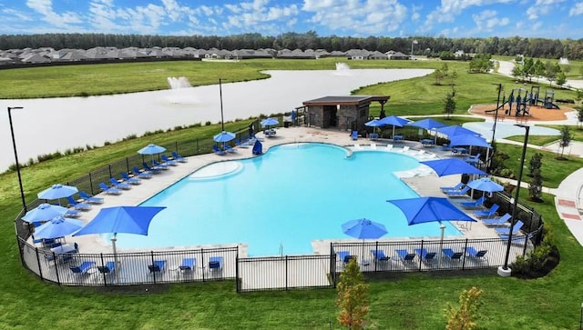 view of pool featuring a patio area and a lawn