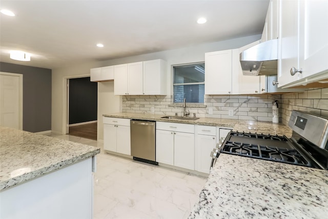 kitchen featuring white cabinetry, sink, light stone countertops, and appliances with stainless steel finishes