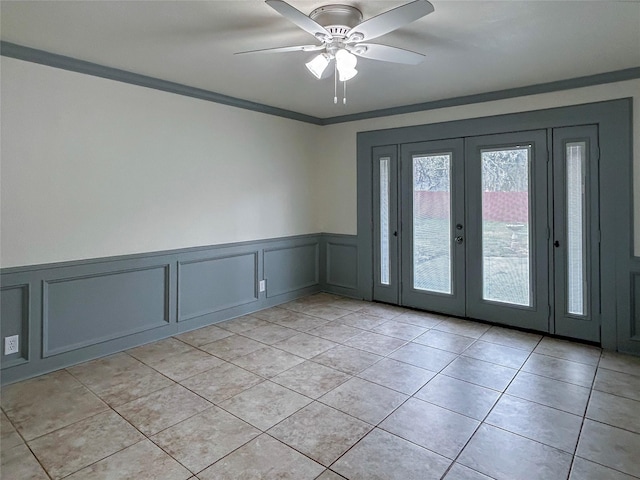 interior space featuring french doors, ceiling fan, and crown molding