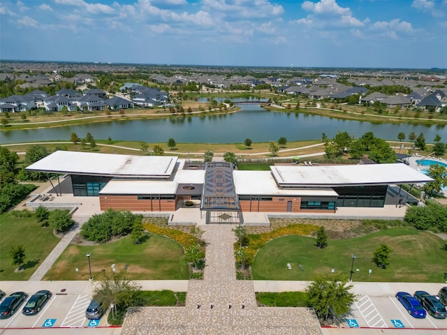 aerial perspective of suburban area featuring a nearby body of water