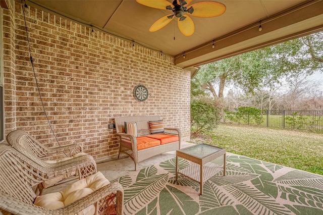 view of patio / terrace featuring a ceiling fan and an outdoor living space