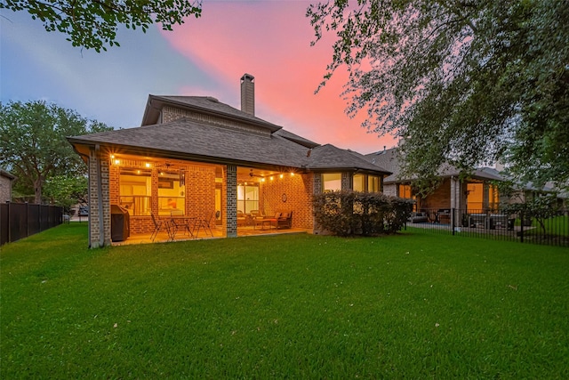 18415 Pin Oak Bend Dr, Cypress, TX 77433 - rear view of house with brick siding, a patio area, a chimney, and a shingled roof