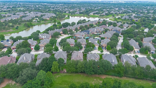 view of property location with nearby suburban area and a large body of water