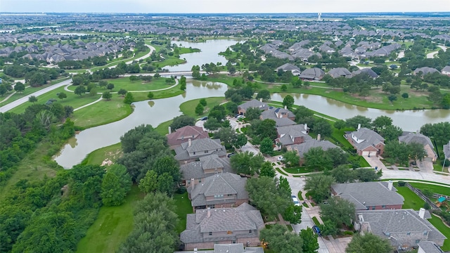 aerial overview of property's location featuring a nearby body of water and nearby suburban area