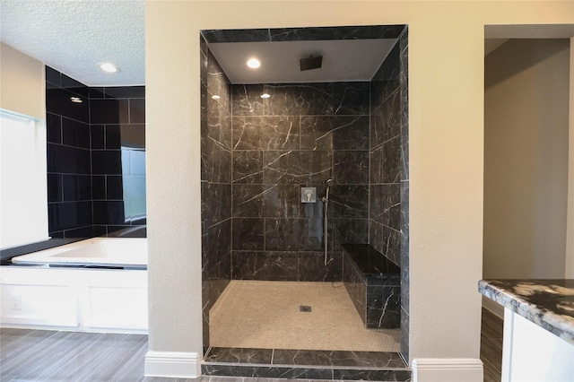 bathroom with separate shower and tub