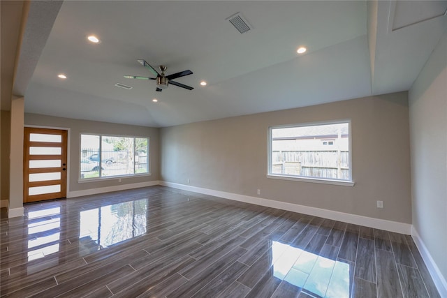 spare room with ceiling fan and vaulted ceiling