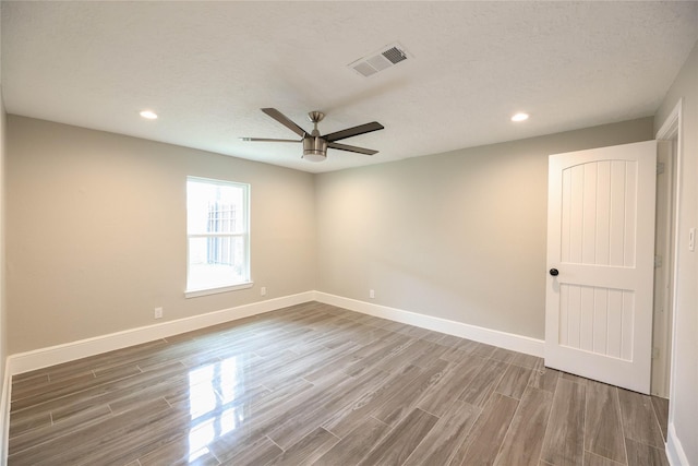 214 Canadian St, Houston, TX 77009 - empty room with visible vents, baseboards, a ceiling fan, and wood finished floors