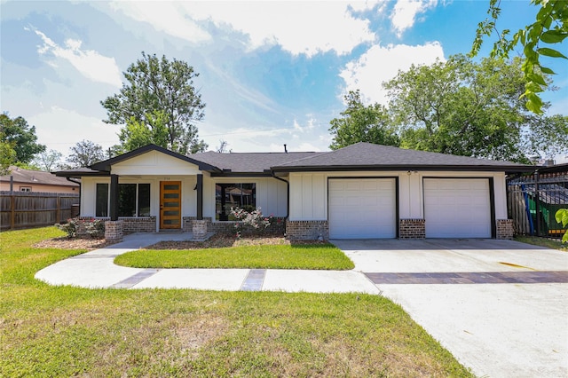 214 Canadian St, Houston, TX 77009 - view of front facade featuring brick siding, fence, driveway, and a garage