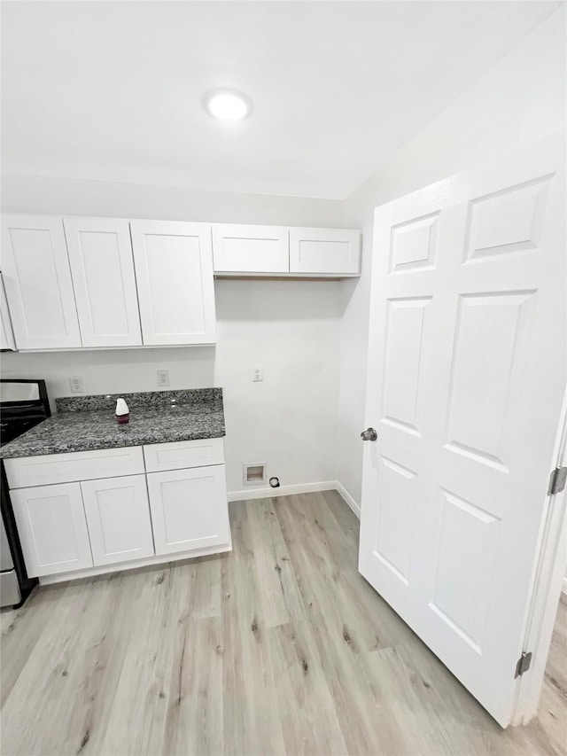 laundry room featuring hookup for a washing machine and light wood-type flooring