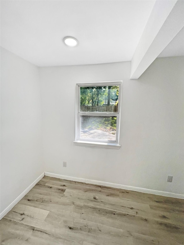 spare room featuring light hardwood / wood-style flooring