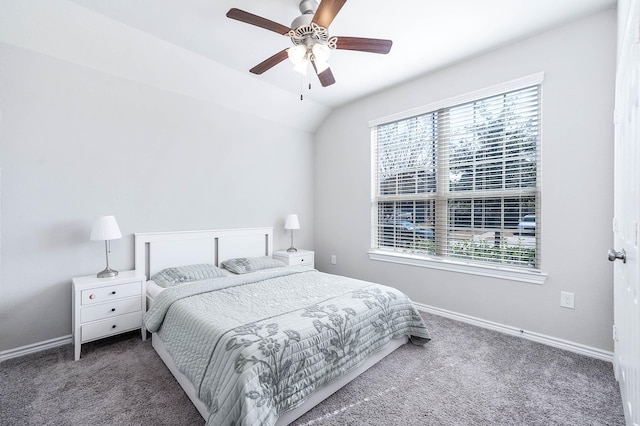 carpeted bedroom with multiple windows, vaulted ceiling, and ceiling fan