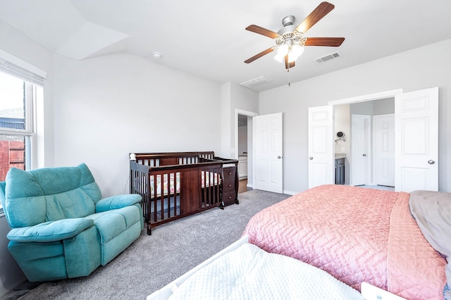 bedroom featuring light carpet, lofted ceiling, and ceiling fan