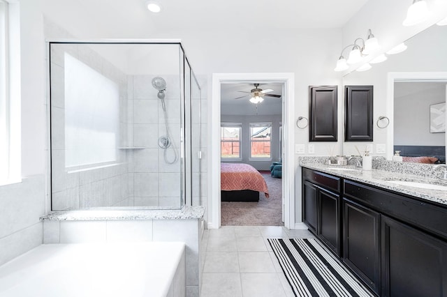 bathroom with tile patterned floors, an enclosed shower, and vanity