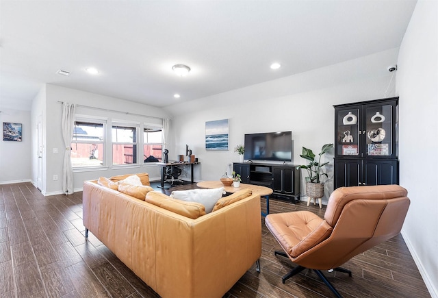 living room featuring lofted ceiling and dark wood-type flooring