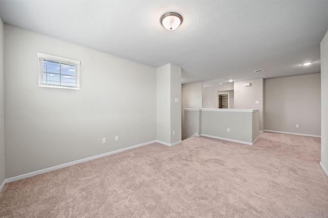 empty room with light colored carpet