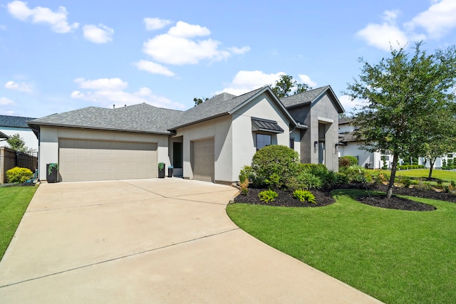 view of front of property featuring a garage and a front yard