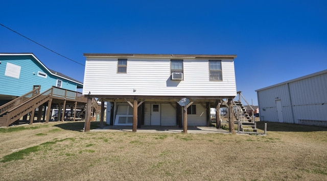 rear view of property featuring cooling unit, a lawn, and a patio