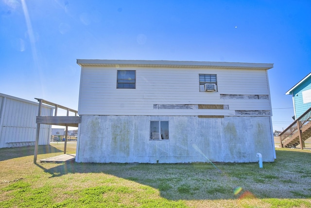 back of house with a yard