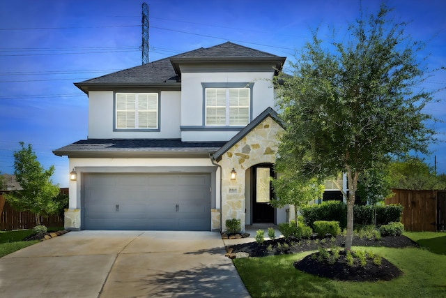 view of front facade featuring a garage and a front lawn