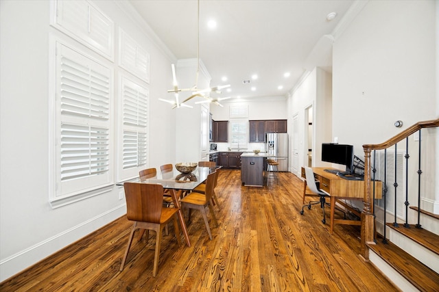 dining room featuring baseboards, ornamental molding, dark wood-style flooring, and recessed lighting