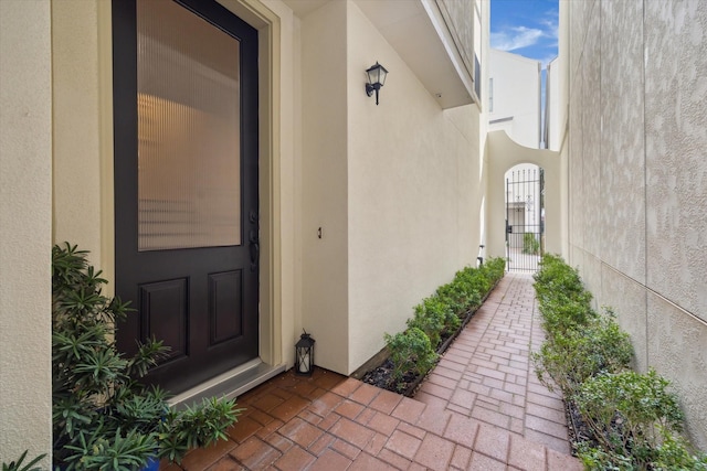 entrance to property with stucco siding