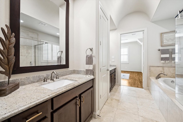 bathroom with a garden tub, visible vents, vanity, a shower stall, and tile patterned floors