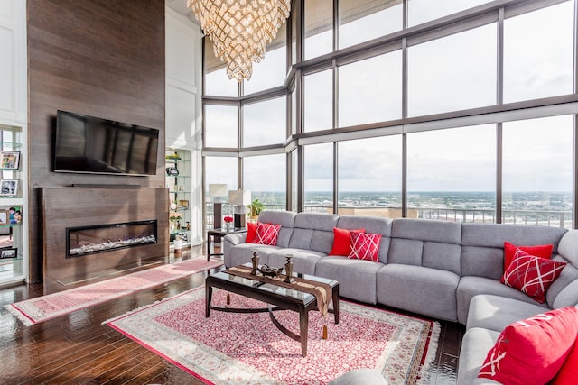 living room featuring hardwood / wood-style flooring and a high ceiling