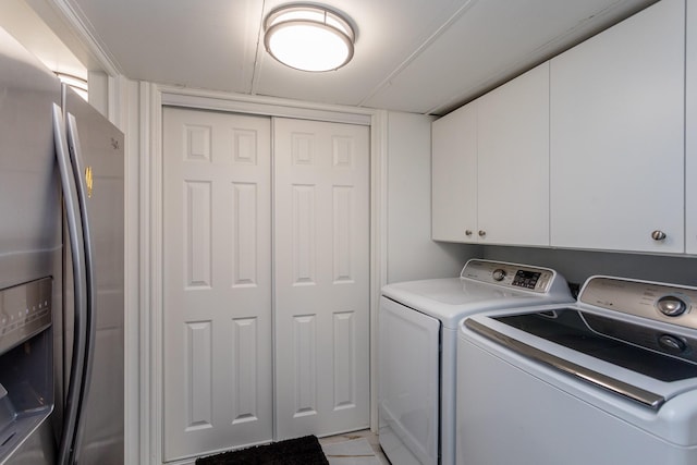 washroom with cabinets and independent washer and dryer