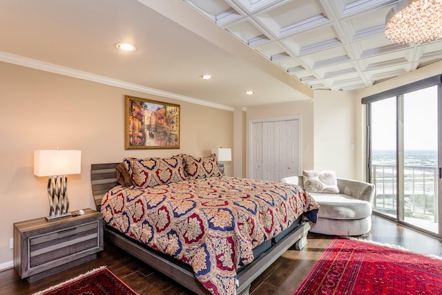 bedroom with coffered ceiling, dark wood-type flooring, access to outside, and crown molding